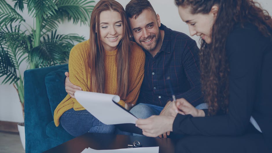 Couple reviewing financial documents together, feeling hopeful